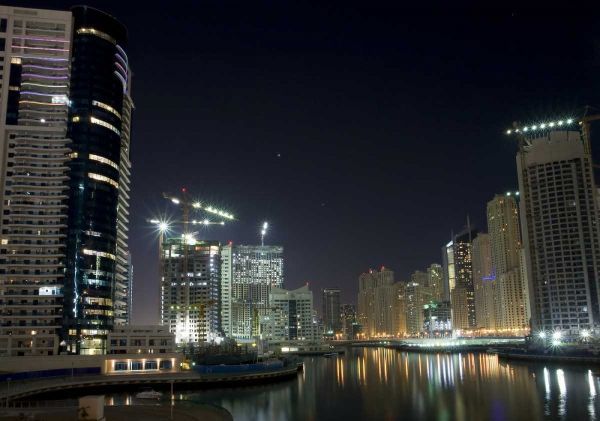 UAE, Dubai Towers on marina at night